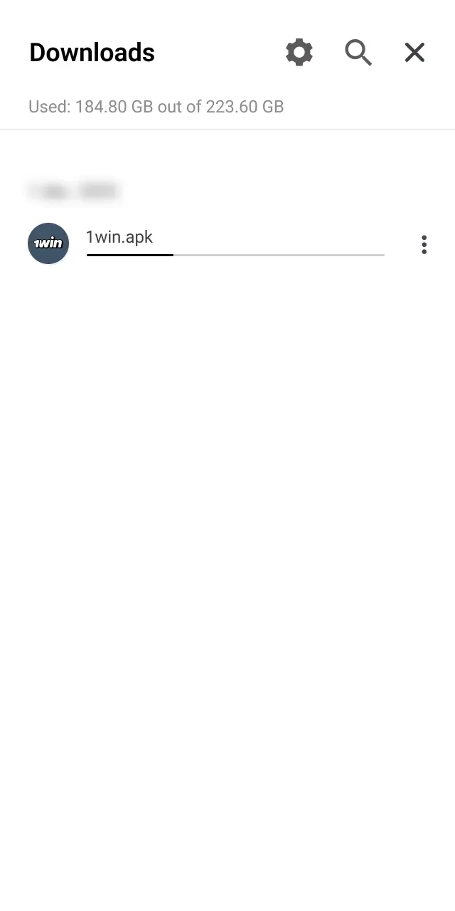 Open your file manager or notification shade and tap the downloaded 1win APK file.